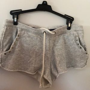 Gray shorts with metal detail on pockets